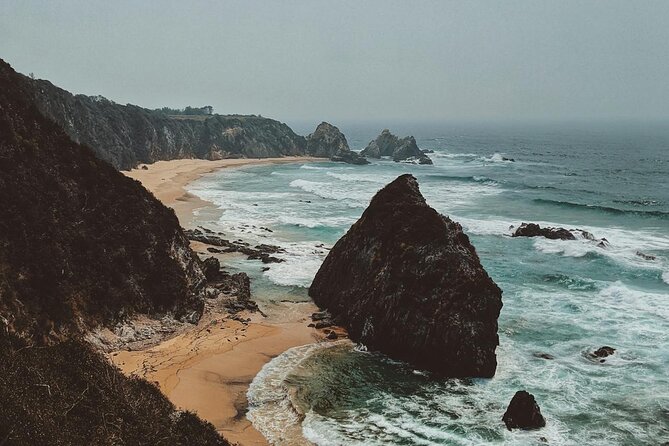 Melbourne: Great Ocean Road & Iconic Coastal Views Day Tour - The Memorial Arch explains how the road began